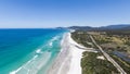 Drone view of Denison Beach and the A3 Tasman Highway north of Bicheno, Tasmania