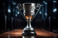 Gleaming Silver Trophy on Black Pedestal: Symbol of Corporate Success