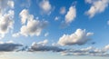Bright blue sky filled with dramatic cumulus clouds Royalty Free Stock Photo