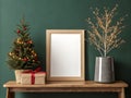Minimalist Christmas Mockup: Stylish Wood Frame, Mini Tree & Green Wall Interior Royalty Free Stock Photo