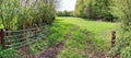 Stunning high resolution panorama of a northern german agricultural landscape on a sunny day with white cloud formations on a blue Royalty Free Stock Photo