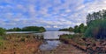 Stunning high resolution panorama of a northern german agricultural landscape on a sunny day with white cloud formations on a blue Royalty Free Stock Photo