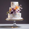 Elegant Delights: Vibrant Floral Adorned Marble Cake on Gold Stand