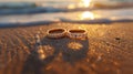 Radiant Backlight Romance: Wedding Rings Gleaming on Sandy Beach