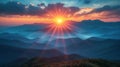 Sunset in the mountains, sunbeams radiate through clouds over a mountainous landscape, showcasing a breathtaking sunrise or sunset Royalty Free Stock Photo