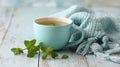 A stunning image of cup of mint tea with fresh mint leaves on a wooden table. Royalty Free Stock Photo