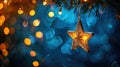 Golden Christmas Star Lights Hanging on Blue Background with Abstract Bokeh Royalty Free Stock Photo