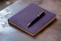 Purple Notebook and Elegant Pen on Table - Trend Color Future Dusk 2025