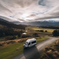 Sleek and Modern Camper Van Parked on a Quiet Country Road with Mountain View