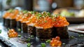 High End Restaurant\'s Exquisite Sushi Presentation: Salmon Roe and Fresh Garnish on Black Slate