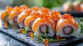High End Restaurant\'s Exquisite Sushi Presentation: Salmon Roe and Fresh Garnish on Black Slate
