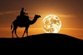 Stunning image of a Tuareg riding a camel in desert at night with full supermoon in the background. Generative Ai