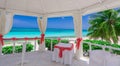 Stunning inviting view from the inside of decorated wedding gazebo on tropical beach tranquil ocean and blue sky Royalty Free Stock Photo