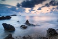 Stunning landscape dawn sunrise with rocky coastline and long exp Royalty Free Stock Photo