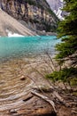 Stunning landscape featuring Moraine lake in the foreground and majestic mountains in the background