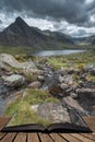 Stunning landscape image of countryside around Llyn Ogwen in Snowdonia during ear;y Autumn coming out of pages of open story book Royalty Free Stock Photo