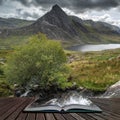 Stunning landscape image of countryside around Llyn Ogwen in Snowdonia during early Autumn coming out of pages of open story book Royalty Free Stock Photo