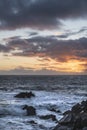 Stunning landscape image of view from Hartland Quay in Devon England durinbg moody Spring sunset Royalty Free Stock Photo