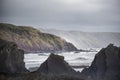 Stunning landscape image of view from Hartland Quay in Devon England durinbg moody Spring sunset Royalty Free Stock Photo