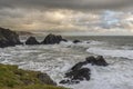 Stunning landscape image of view from Hartland Quay in Devon England durinbg moody Spring sunset Royalty Free Stock Photo