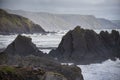 Stunning landscape image of view from Hartland Quay in Devon England durinbg moody Spring sunset Royalty Free Stock Photo