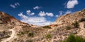 Stunning landscape of a semi-arid rocky area with a cloudy blue sky in the USA Royalty Free Stock Photo