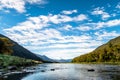 Stunning landscpae of the reflection of the snow mountain on the river. Blue sky and some cloudy. I