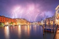 Stunning lightning at night sky over city of f Venice with famous Canal Grande and Rialto Bridge