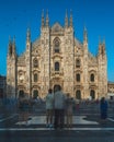 Stunning long-exposure image of a group of people enjoying the view of the iconic Milan Cathedral