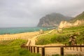 Lush green landscape and Marneef Cave at Al Mughsayl Beach Mountains, Salalah, Oman Royalty Free Stock Photo