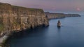 The stunning and majestic Cliffs of Moher in County Clare, Ireland at sunset, beautiful pink sky Royalty Free Stock Photo