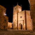 Stunning medieval stone buildings and palaces at night in Caceres, Spain.