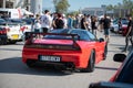 stunning mid-engine V6 Honda NSX. It is red with carbon fiber spoiler and rear diffuser