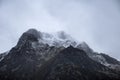 Stunning moody dramatic Winter landscape image of snowcapped Y Garn mountain in Snowdonia Royalty Free Stock Photo