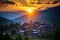 a stunning mountain sunset framing a village silhouette