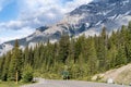 Stunning mountains surround the road leading to Two Jack Lake in Banff National Park