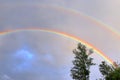 Stunning natural double rainbows plus supernumerary bows seen at a lake in northern germany Royalty Free Stock Photo