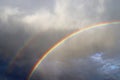 Stunning natural double rainbows plus supernumerary bows seen at a lake in northern germany Royalty Free Stock Photo