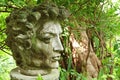 Old Stone Figure of Greek Man Head in a Garden Royalty Free Stock Photo