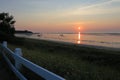 Stunning orange and pink skies from the sun setting over Cape Cod Bay Royalty Free Stock Photo