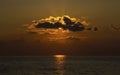 Stunning orange sunset at sea bright sun create solar path on a quiet surface