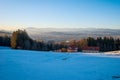 Stunning outdoor landscape of a grassy field blanketed in snow