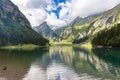 Stunning panorama view of Alpstein massif with Santis Saentis on Seealpsee lake side on a sunny summer day, with blue sky cloud Royalty Free Stock Photo