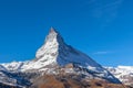 Stunning panorama view of the famous Matterhorn peak of Swiss Alps on sunny autumn day with snow and blue sky, from the train