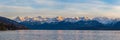 Stunning panorama view of famous Swiss Alps peaks on Bernese Oberland Eiger North Face, Monch, Jungfrau at dusk from Lake Thun