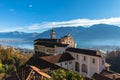 Stunning panorama view of Madonna del Sasso church above Locarno city with Lake Maggiore, snow covered Swiss Alps mountain and Royalty Free Stock Photo