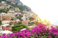 Stunning panoramic view of Positano village with flowers and sun Royalty Free Stock Photo