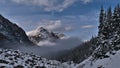 View of the Rocky Mountains with Franchere Peak above a sea of clouds in Astoria River Valley in Jasper National Park, Canada. Royalty Free Stock Photo