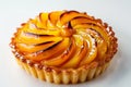 A stunning peach tart with a beautifully arranged fan of fresh peach slices atop a crisp pastry crust Royalty Free Stock Photo