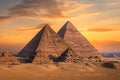 A stunning photo capturing a group of pyramids standing tall in the desert as the sun sets, casting a warm glow on the ancient Royalty Free Stock Photo
